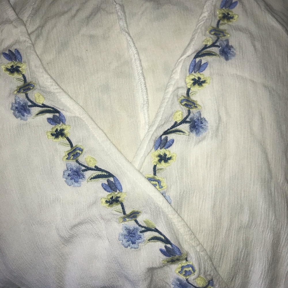White cross top with embroidered flowers